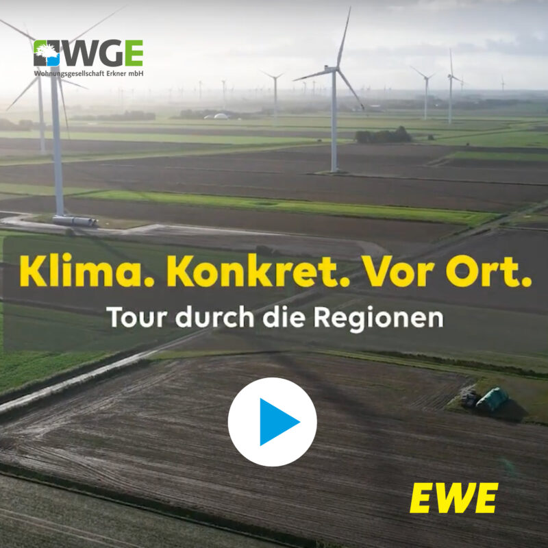 Video-Thumbnail mit Windrädern über weiten Feldern; eingeblendete Logos „WGE“ und „EWE“ sowie der Text „Klima. Konkret. Vor Ort. – Tour durch die Regionen“ und ein Play-Button in der Bildmitte.